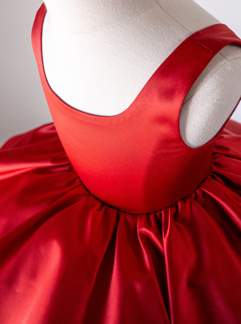 Girl in red satin dress