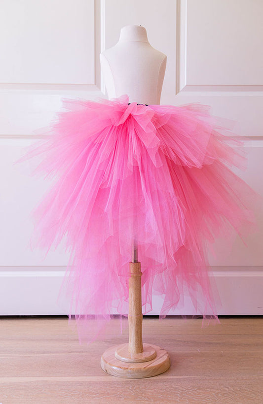 Pink tulle skirt for girls displayed on mannequin, perfect for birthdays, parties and dress up