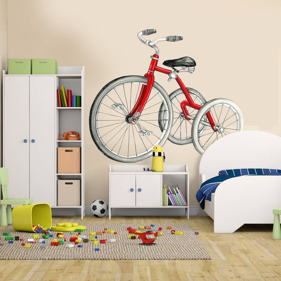 Red vintage bicycle wall decal on kids room wall above white storage cabinet