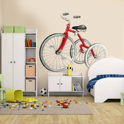 Red vintage bicycle wall decal on kids room wall above white storage cabinet