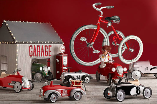 Red vintage bicycle wall decal on playroom wall with toy cars and garage theme decor