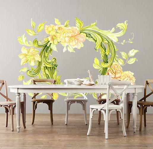 Vine floral wall decal with yellow flowers on dining room wall behind farmhouse table and chairs