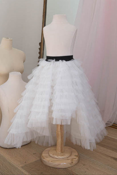 White layered tulle skirt with black waistband for girls displayed on mannequin