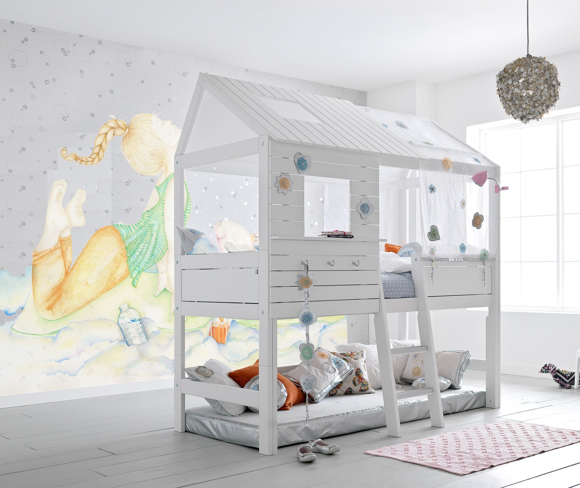 Yoga girl wall decal on nursery room wall behind white kids bed